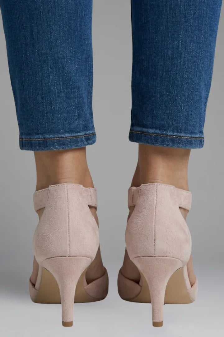Back view of pink suede heels highlighting the closed heel counter and zip fastening