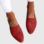 Red woven leather slingback flats with pointed toe and adjustable strap, shown from above