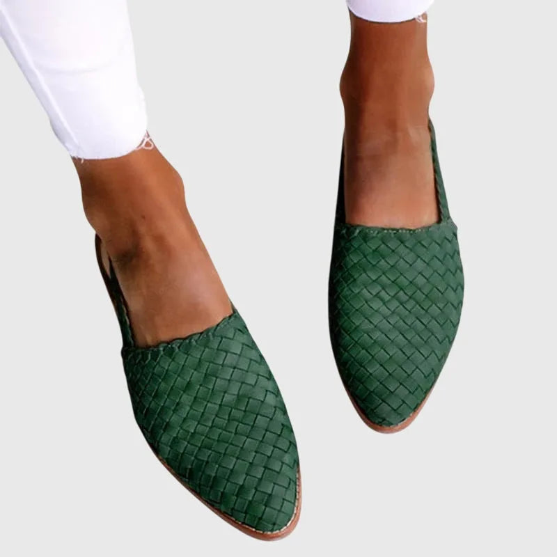 Deep green woven leather slingback flats with pointed toe, viewed from the front