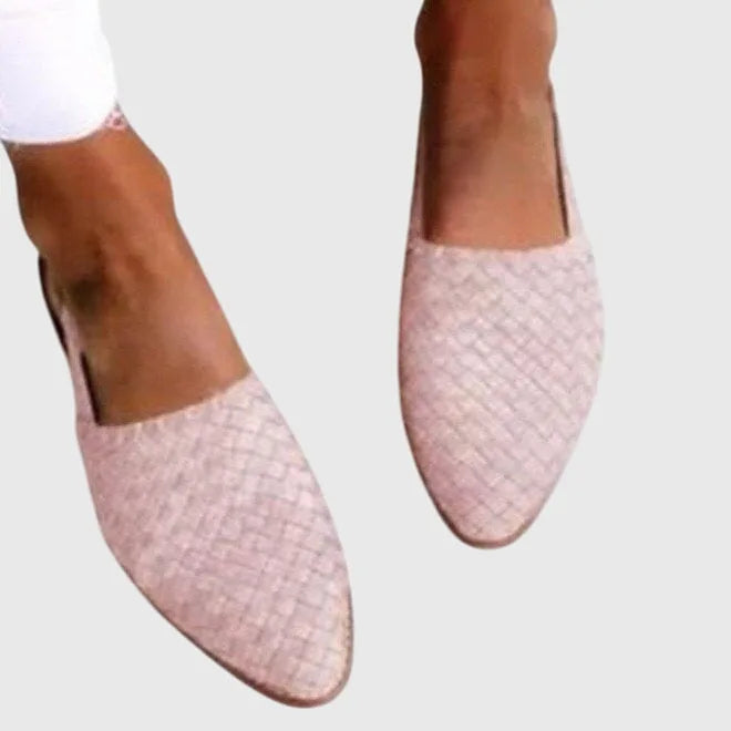 Light pink woven textured slingback flats with pointed toe, shown on both feet