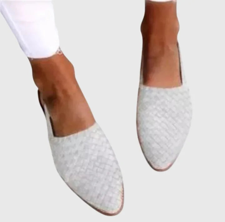White woven textured slingback flats with pointed closed toe, viewed from above