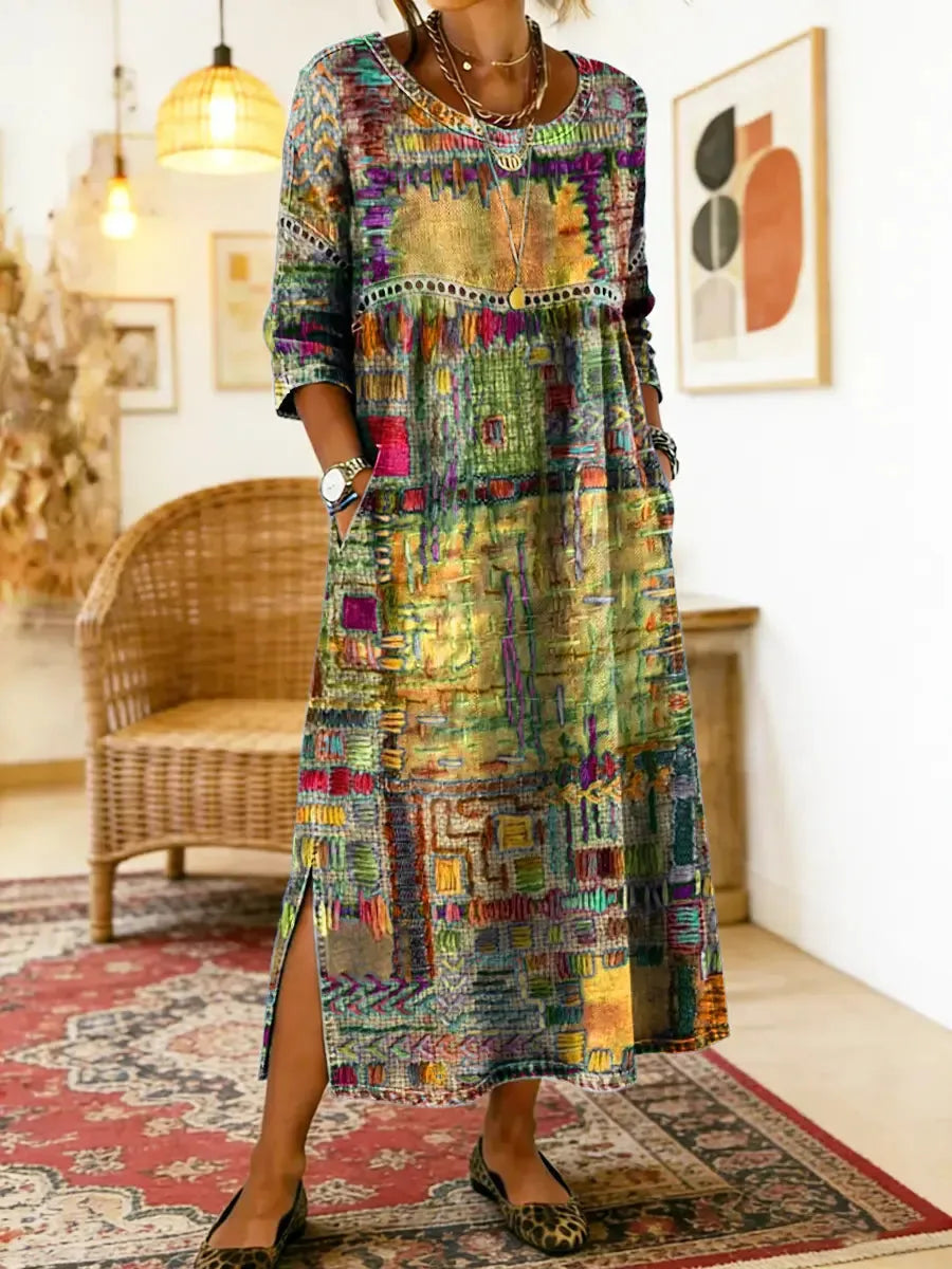 Golden-yellow patchwork-print midi dress with crochet trim, worn with leopard flats on a patterned rug