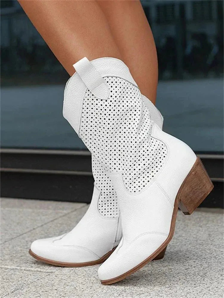 Side profile of white perforated leather western boots highlighting the wooden-look stacked heel