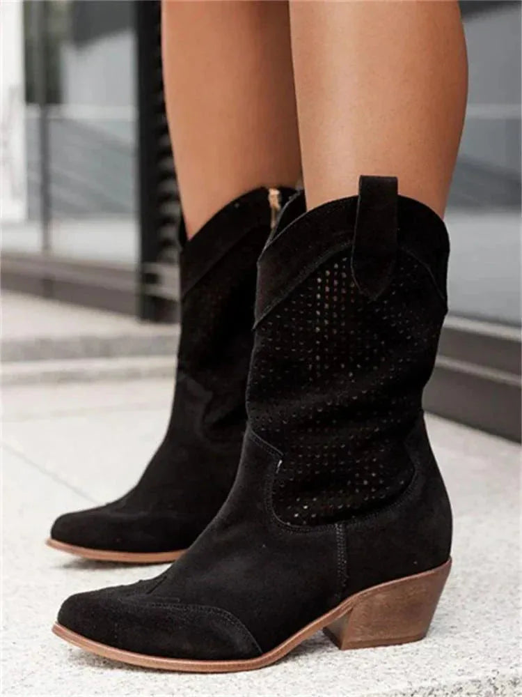 Black suede perforated mid-calf western boots shown from the side with pointed toe and block heel