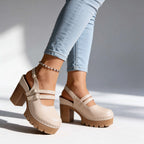 Tan and red platform clog heels paired together, showing the triple buckle strap and slingback design
