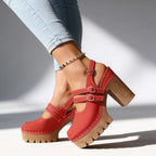 Red slingback clog heels with triple buckle straps, close-up showing chunky block heel and platform sole