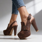 Studio close-up of brown platform slingback heels on crossed ankles, highlighting the stitched toe and buckle strap