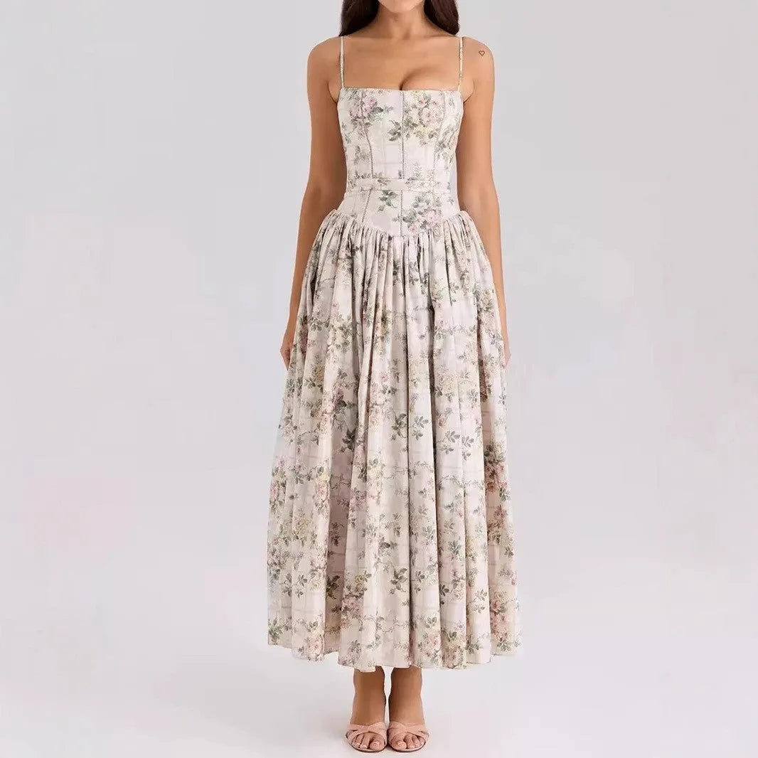 Front view of a corset midi dress in a soft lilac and blue grand floral print with thin straps