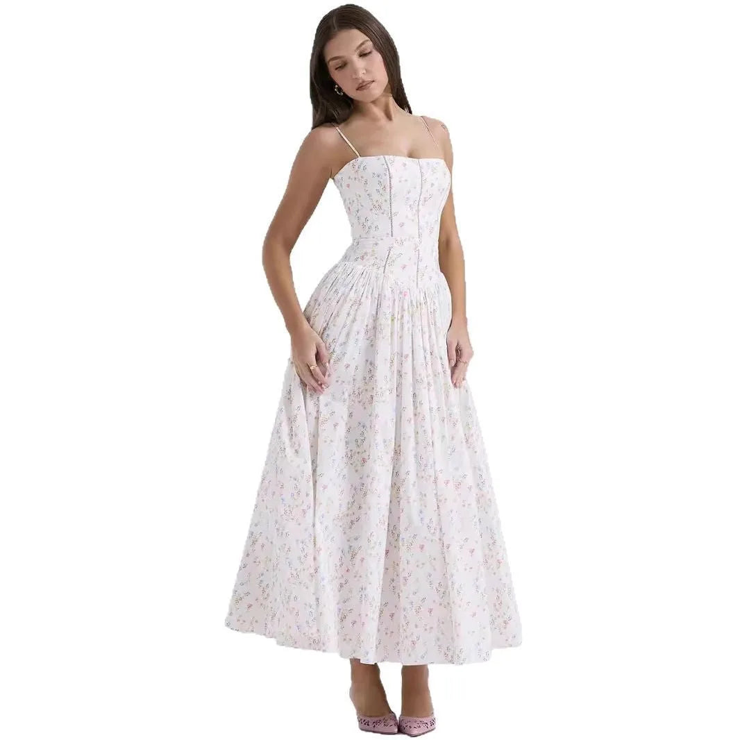 Front view of a pale floral plaid print corset midi dress with a gathered pleated skirt