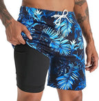 Close-up of navy and blue palm leaf print swim shorts with black inner layer and side pocket