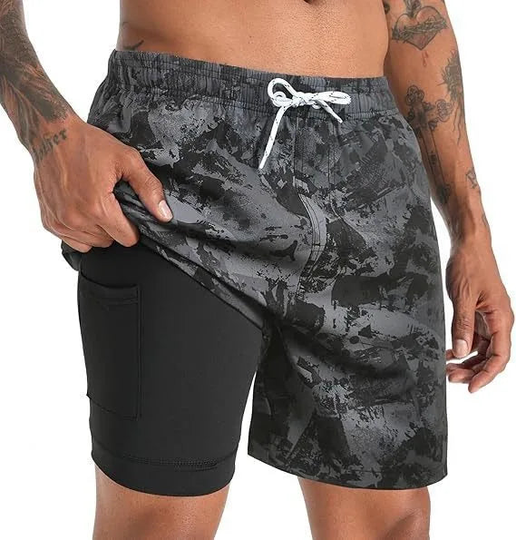 Front close-up of the elastic waistband and teal drawstring cord with metal tip details