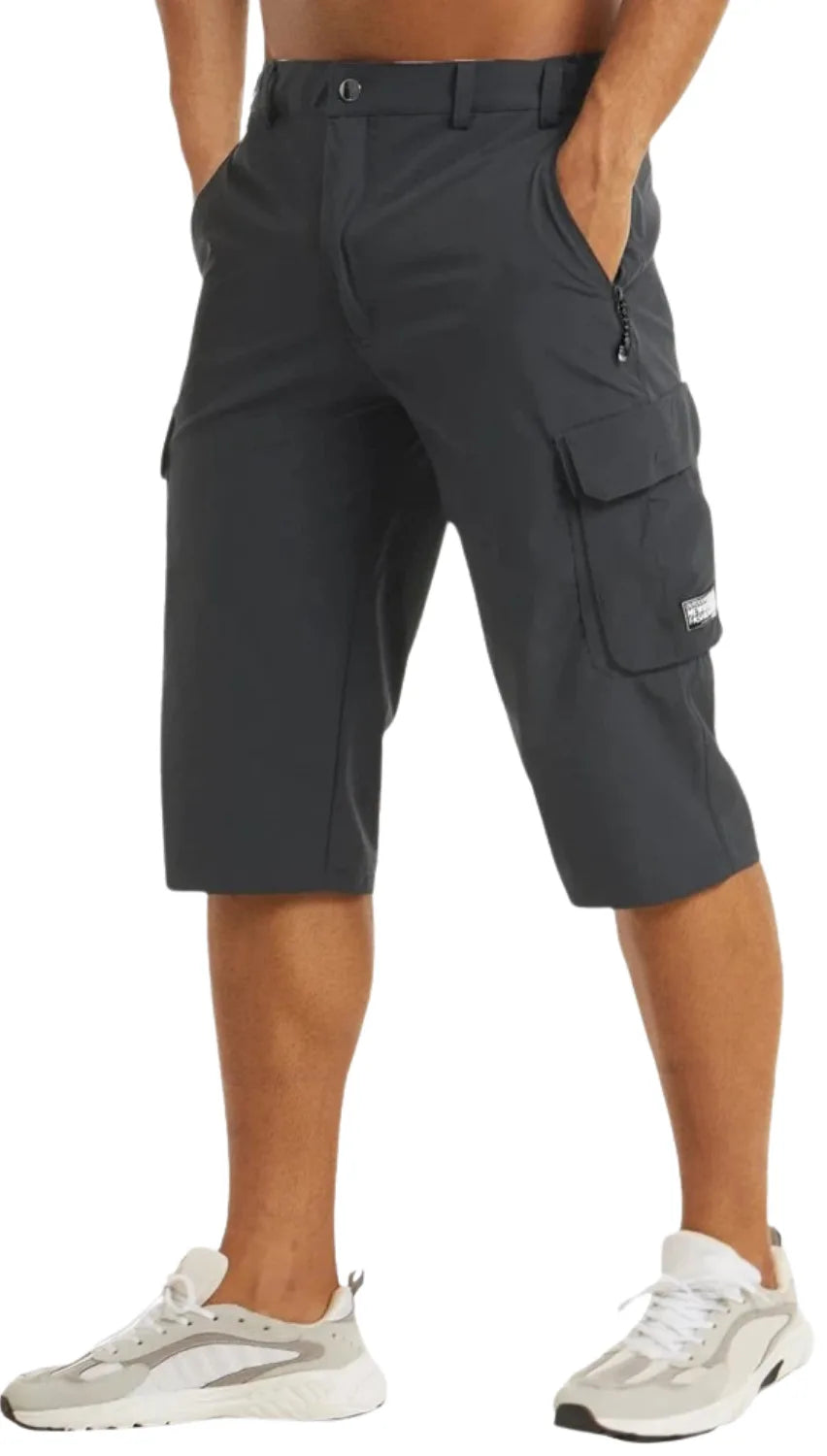Charcoal grey cargo shorts in a three-quarter side view showing the tapered knee-length hem