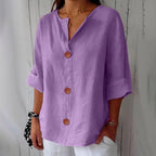 Full front view of a relaxed-fit button-up blouse showing the overall loose, breathable silhouette