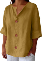 Mustard yellow linen-look blouse with wooden buttons, shown from the front against a plain background