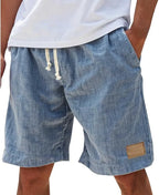 Black cotton shorts in textured weave, back view with drawstring tied and side pocket visible