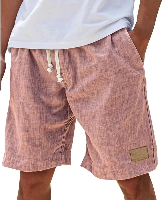Grey cotton shorts shown from the side, displaying elastic waist and relaxed fit
