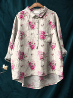 Shirt displayed on a wooden hanger showing the rolled long sleeves and patch chest pocket