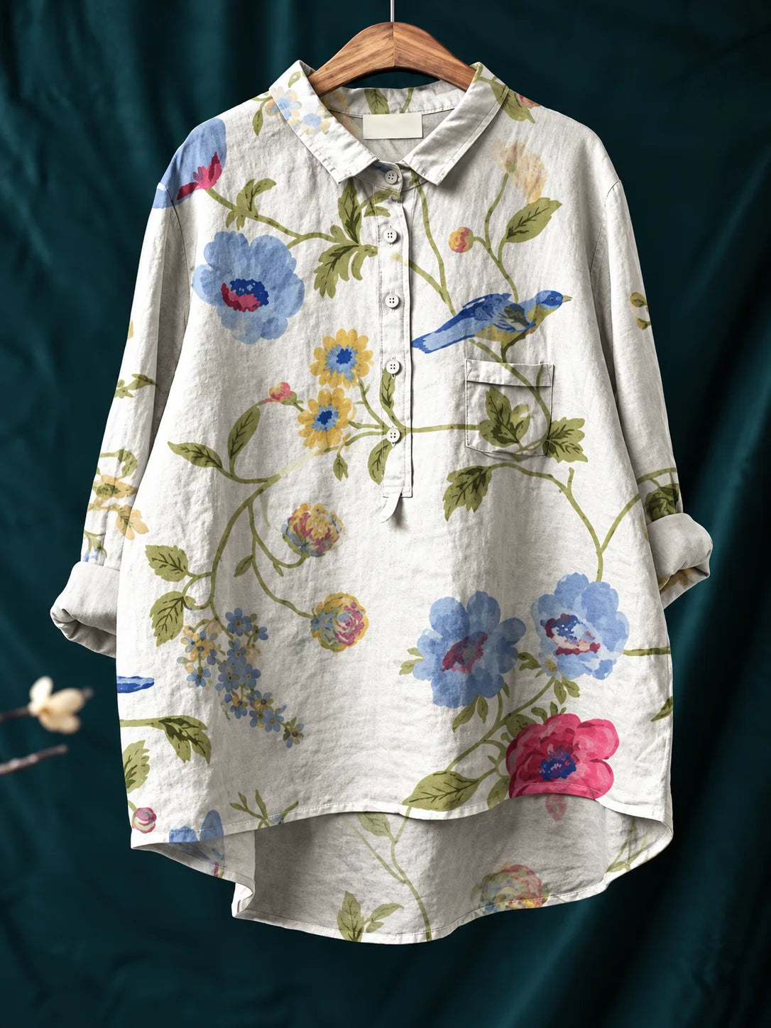 Close-up of the chest pocket detail stitched into the floral printed fabric