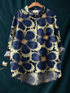 Navy shirt with an oversized scalloped floral print in sage green and mustard outlines