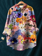Oversized floral shirt featuring layered pansies, daisies and blossoms in purple, orange and pink