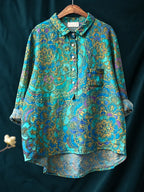 Teal shirt printed with an ornate mandala-style paisley pattern in gold and purple tones