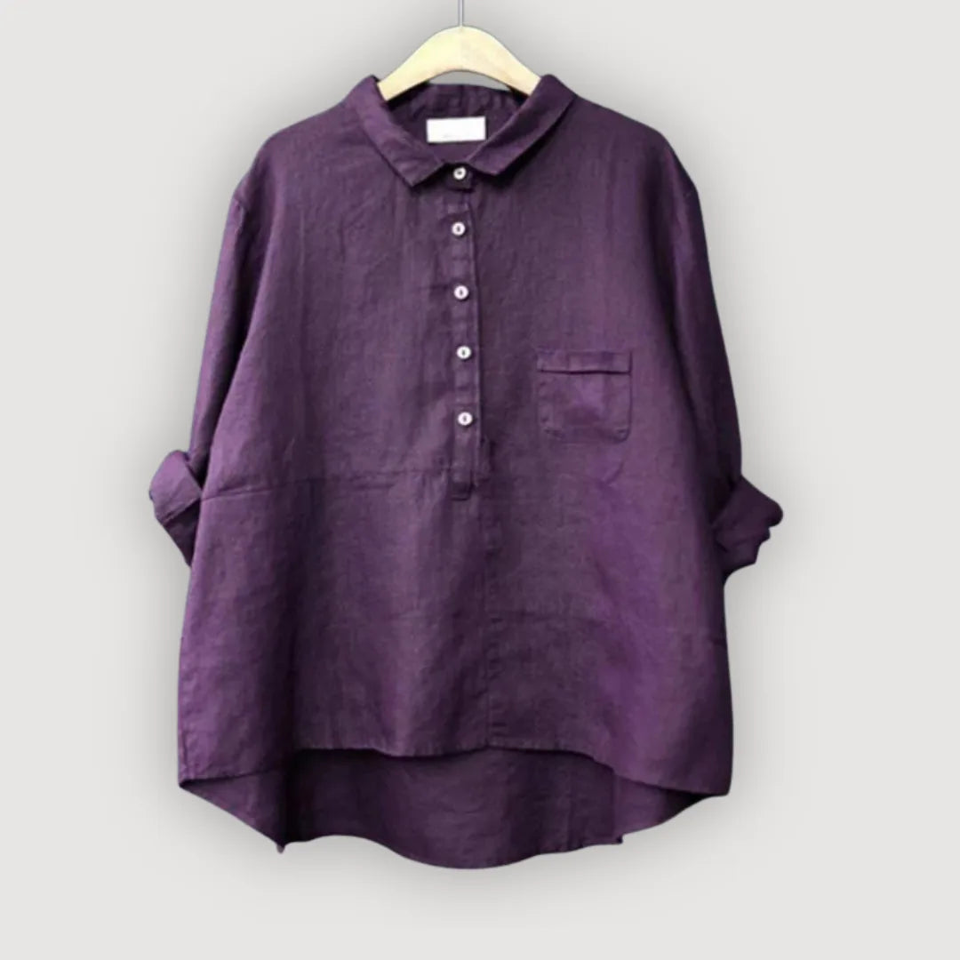 Deep violet linen blouse with mother-of-pearl style buttons and a single chest pocket on a hanger