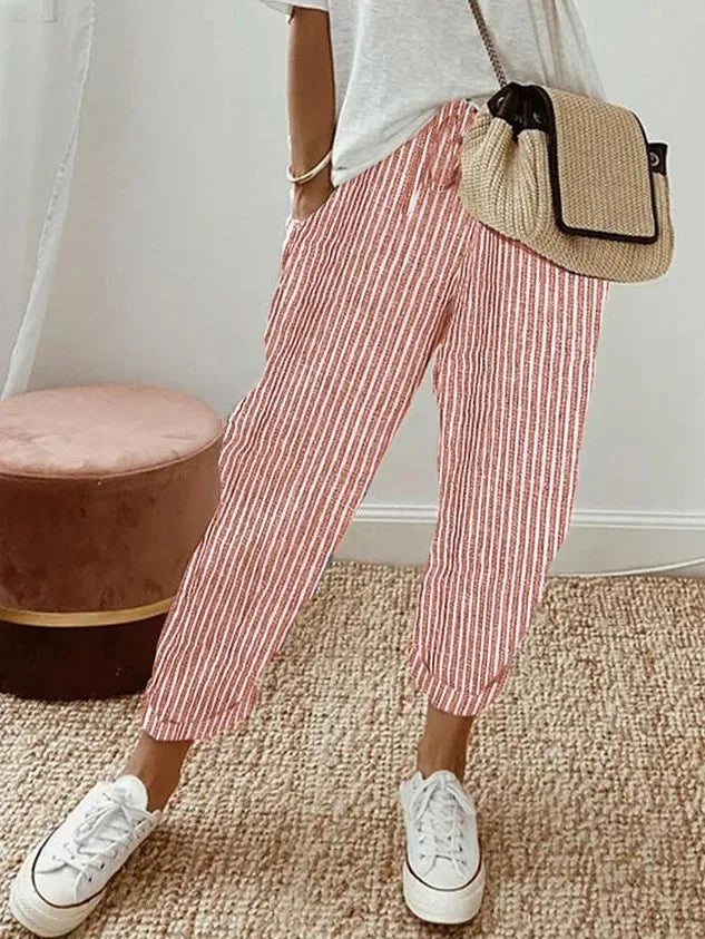 Red and white striped relaxed pants with drawstring waist and rolled cuffed ankle hems