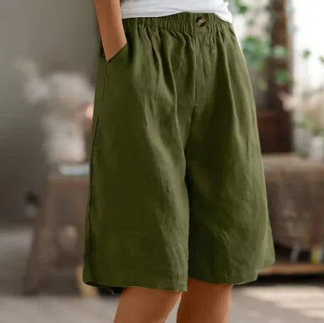 Side view of army green linen-look shorts with elastic waistband, button detail and deep side pocket