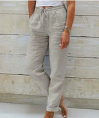 Light grey linen pants with tied drawstring waist, side pocket detail and cuffed ankle hem