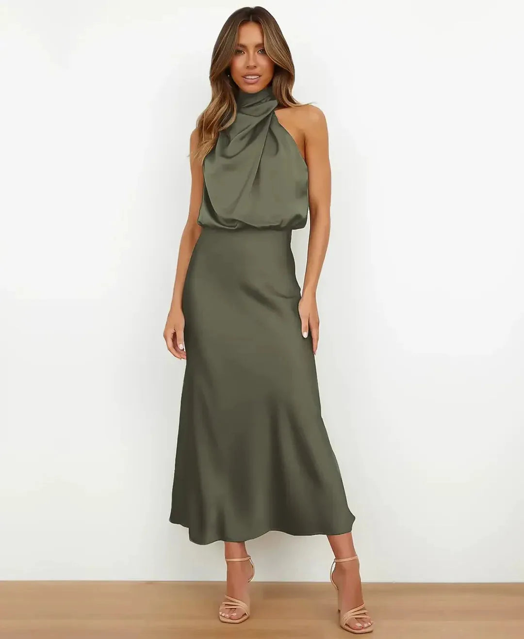 Front view of model wearing olive green satin midi dress with draped cowl neckline