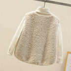 Taupe sherpa fleece vest hanging with visible V-neckline and patch pockets, paired with a cream ribbed jumper