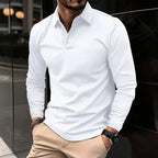 Front view of a man wearing a white long-sleeve polo shirt with white buttons and a classic collar, paired with beige pants