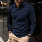 Navy long-sleeve polo shirt with contrast white buttons, shown buttoned up to the collar on a model