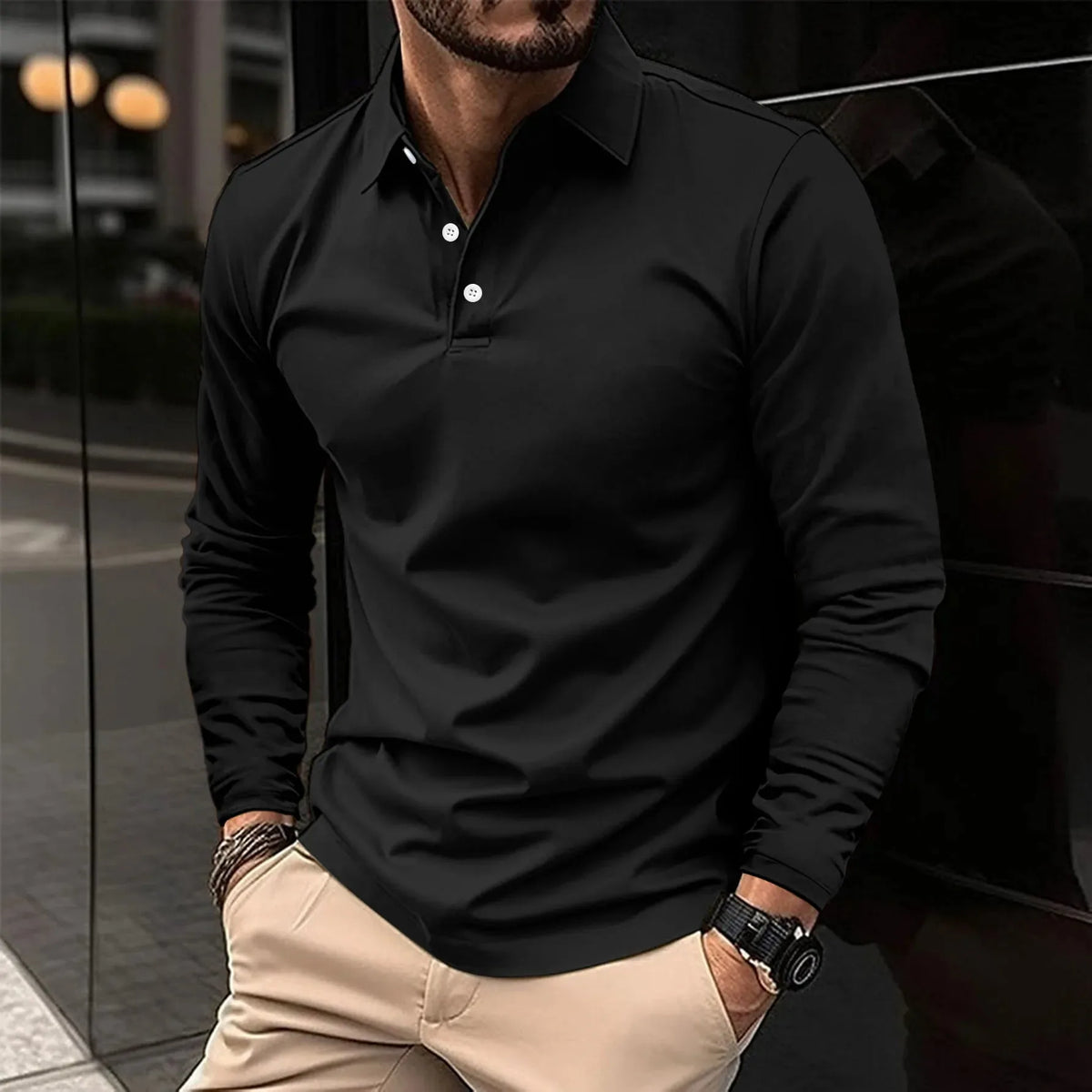 Black long-sleeve polo shirt with white buttons, fitted silhouette shown from the chest down