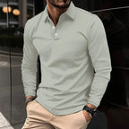 Sage green long-sleeve polo shirt with a structured collar, close-up view of the fabric texture