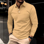 Beige/tan long-sleeve polo shirt with white button detailing, classic collar standing upright