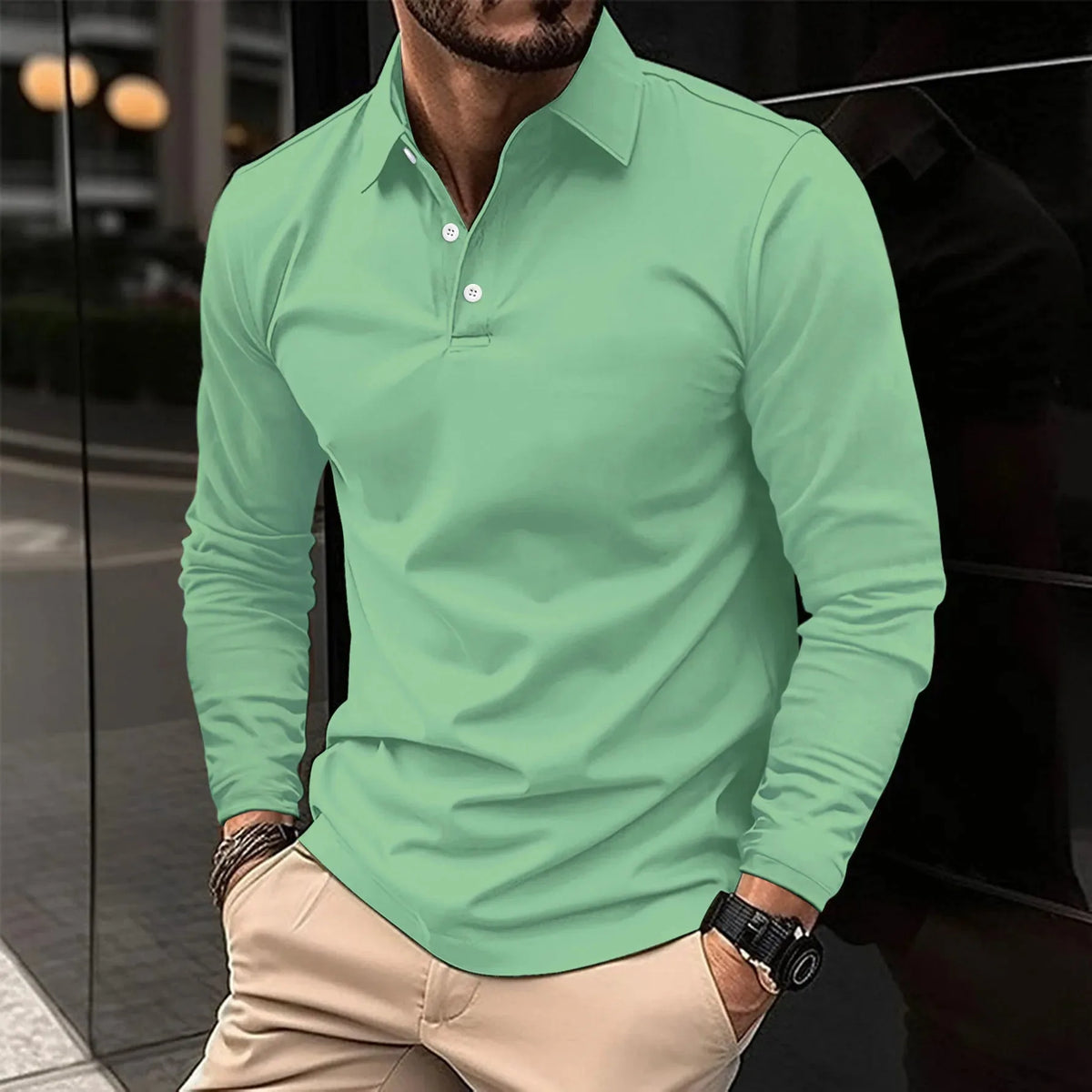 Light green long-sleeve polo shirt worn casually, showing the relaxed drape of the sleeves and hem