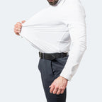 Close-up side angle of the white shirt being pulled wide at the waist, showing smooth stretch recovery