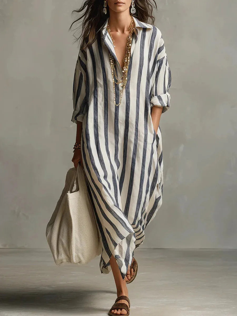 Front view of a red striped maxi shirt dress with pockets and a woven tote bag