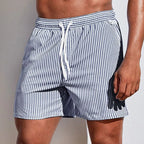 Side view of navy and white striped boardshorts with white drawstring and visible side seam