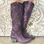 Front view of purple leather knee-high western boots with silver stud embroidery, pointed toes and stacked block heels