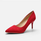 Side profile of red suede pointed toe pump with slender kitten heel