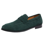 Dark green suede penny loafer photographed from a side angle on a white background