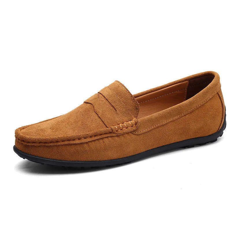 Tan brown suede penny loafer with contrasting tan leather interior and black rubber outsole