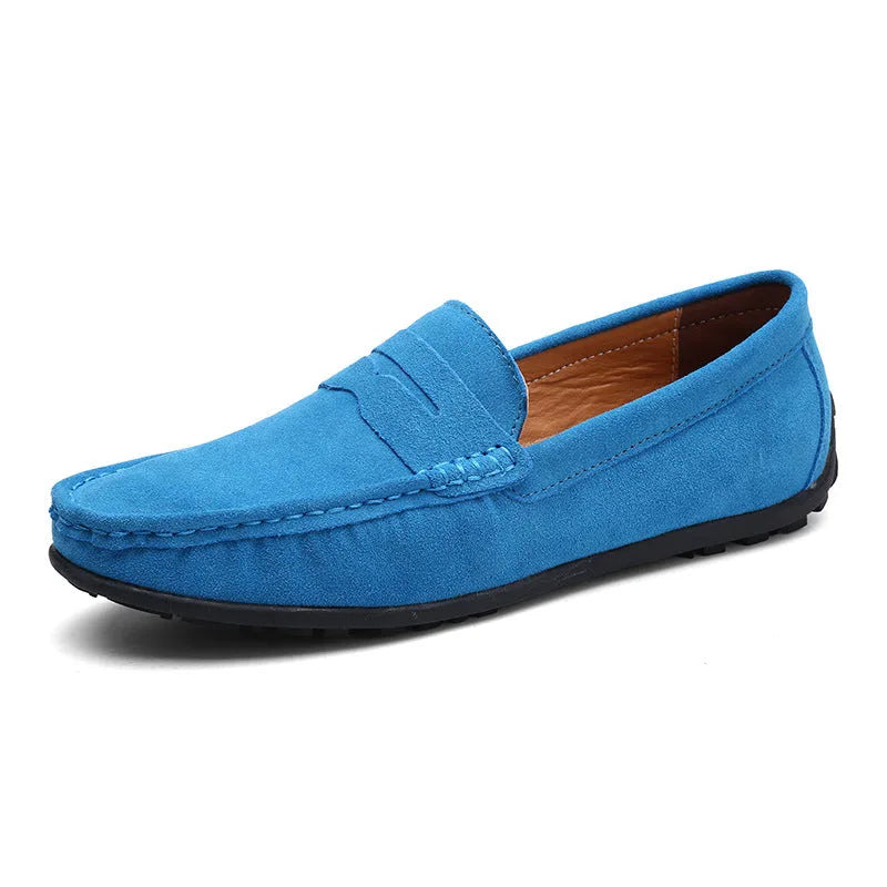Dark burgundy brown suede penny loafer shown at an angle with tan leather lining visible