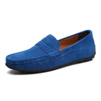 Bright sky blue suede penny loafer with saddle strap and black pebbled rubber sole