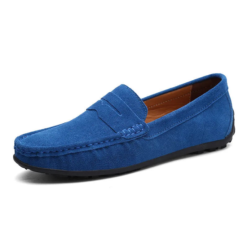 Bright sky blue suede penny loafer with saddle strap and black pebbled rubber sole