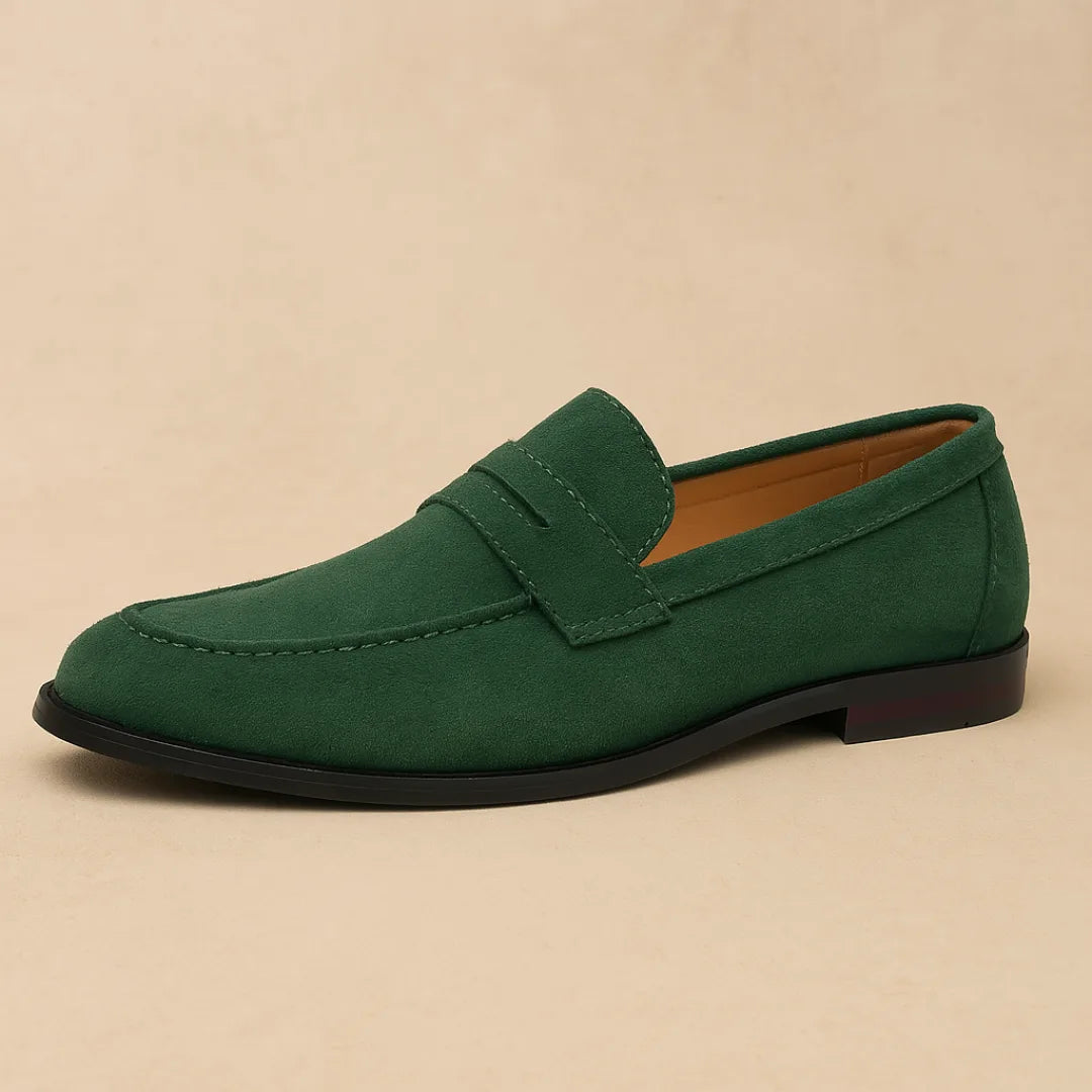 Single forest green suede penny loafer with a rounded toe and black sole, shown in side profile