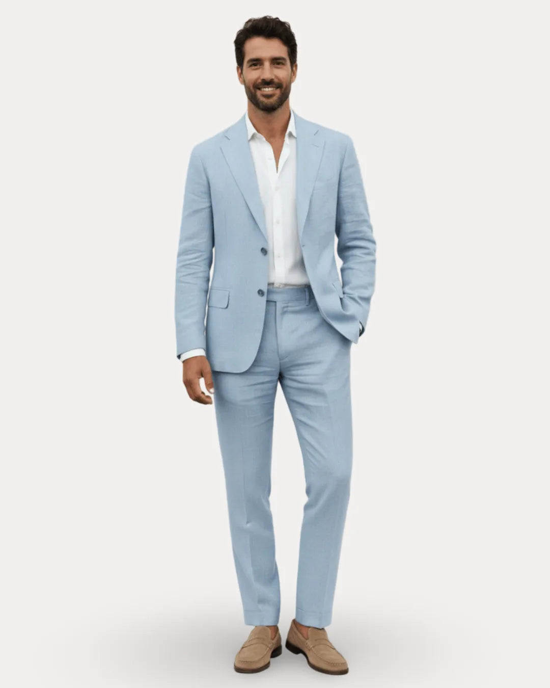 Front view of a man in a pale blue linen suit paired with a white shirt and tan loafers