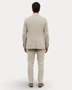 Back view of the beige linen suit highlighting the natural linen texture and tailored silhouette
